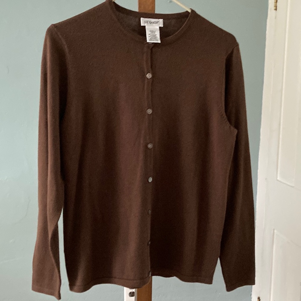 Brown long sleeve cardigan sweater. Size small but fits more like medium.